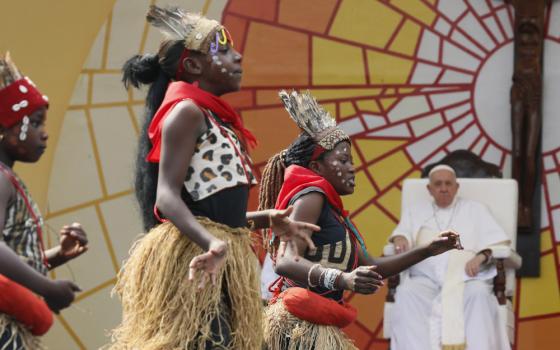 Pope Francis watches as dancers perform during a meeting with young people and catechists in Martyrs' Stadium in Kinshasa, Congo, Feb. 2, 2023. (CNS photo/Paul Haring)
