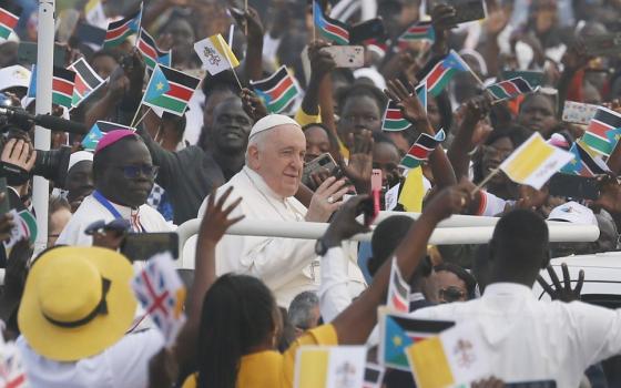 Pope Francis greets the crowd as he arrives to celebrate Mass at the John Garang Mausoleum in Juba, South Sudan, Feb. 5, 2023. 