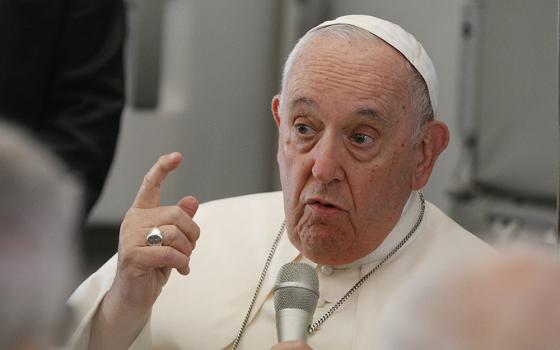 Pope Francis answers questions from journalists aboard the flight from Juba, South Sudan, to Rome Feb. 5. (CNS/Paul Haring)