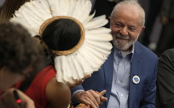 Puyr Tembe, leadership from Brazil's Indigenous People Articulation, left, greets Brazilian President-elect Luiz Inacio Lula da Silva at the COP27 U.N. climate summit Nov. 17, 2022, in Sharm el-Sheikh, Egypt. (AP photo/Peter Dejong)