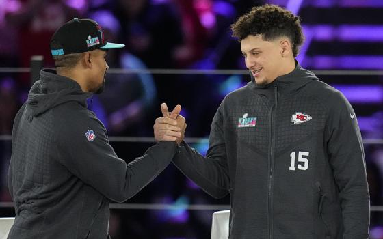 Philadelphia Eagles quarterback Jalen Hurts, left, and Kansas City Chiefs quarterback Patrick Mahomes shake hands during the NFL football Super Bowl 57 opening night, Monday, Feb. 6, 2023, in Phoenix. The Kansas City Chiefs will play the Philadelphia Eagles on Sunday, Feb. 12. (AP photo/Ross D. Franklin)