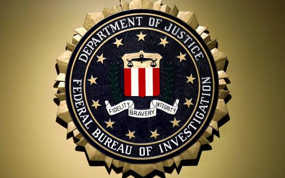 The Federal Bureau of Investigation seal is seen at FBI headquarters before a 2018 news conference in Washington. (OSV News/Reuters/Yuri Gripas)