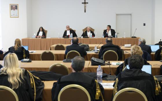 Lucia Bozzi, Venerando Marano, Giuseppe Pignatone and Carlo Bonzano, judges of the Vatican City State court, listen to presentations March 9, 2023, during the trial of Cardinal Angelo Becciu and nine other defendants on charges of financial malfeasance. The trial is being held in a makeshift courtroom at the Vatican Museums. (CNS photo/Vatican Media)