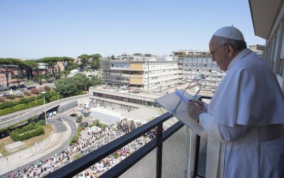 Pope Francis prays the Angelus from the balcony of his room at Gemelli hospital in this file photo taken in Rome July 11, 2021, when the pope was in the hospital for 10 days to recover from a scheduled colon surgery. (CNS photo/Vatican Media)
