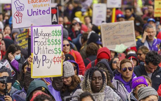 Thousands of Los Angeles Unified School District teachers and Service Employees International Union 99 members rally outside the school district headquarters in Los Angeles March 21. (AP Photo/Damian Dovarganes)