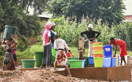 Women collect water in Blantyre, southern Malawi, March 17. (AP/Thoko Chikondi)