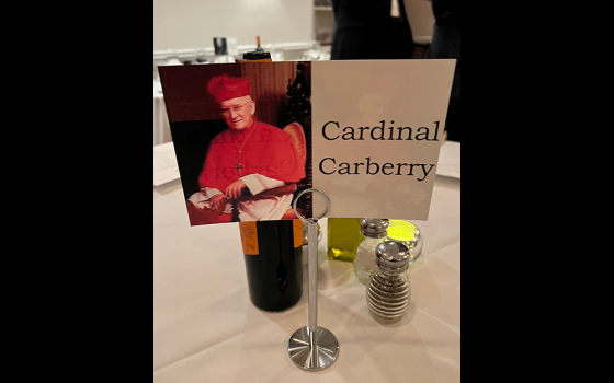 A "cardinal" table number featuring Cardinal John Carberry is pictured. Tables were named for cardinals during a group dinner that was part of a two-day ecclesial gathering March 3-4 at Boston College. (NCR photo/Brian Fraga)
