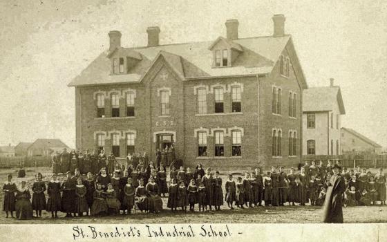 Students, sisters, and a priest pose before the newly reconstructed St. Benedict's Industrial School, an off-reservation boarding school for students from the White Earth Tribe in Minnesota, in 1886. ("Indian Girls Industrial School," College of Saint Benedict/Saint John's University Libraries, accessed March 28, 2023, https://csbsjulib.omeka.net/items/show/915.)