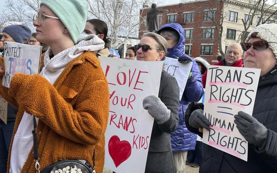 Advocates for transgender youth rally outside the New Hampshire Statehouse March 7 in Concord. House and Senate committees are holding public hearings on four bills opponents say would harm the health and safety of transgender youth. U.S. bishops issued a document March 20 rejecting gender-affirming medical treatments for transgender individuals. (AP photo/Holly Ramer)