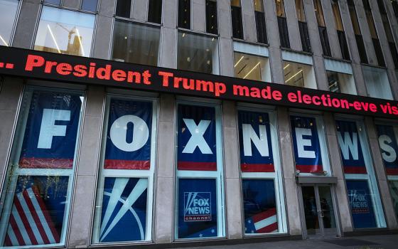 A headline about then-President Donald Trump is displayed outside Fox News studios in New York on Nov. 28, 2018. Documents in a defamation lawsuit illustrate pressures faced by Fox News journalists in the weeks after the 2020 presidential election. The network was on a collision course between giving its conservative audience what it wanted and reporting uncomfortable truths about then-President Donald Trump and his false fraud claims. (AP Photo/Mark Lennihan, File)