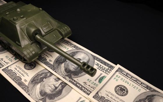 Military tank on top of $100 bills (Dreamstime/Michael Nesterov)