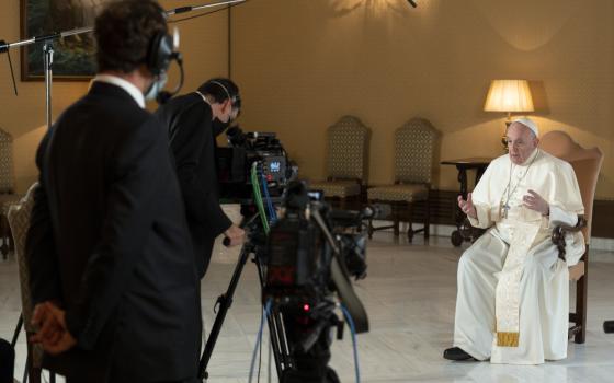 Pope Francis is interviewed at the Vatican for "Stories of a Generation," a Netflix series based on the pope's book, "Sharing the Wisdom of Time." (CNS/Vatican Media/Simone Risoluti)