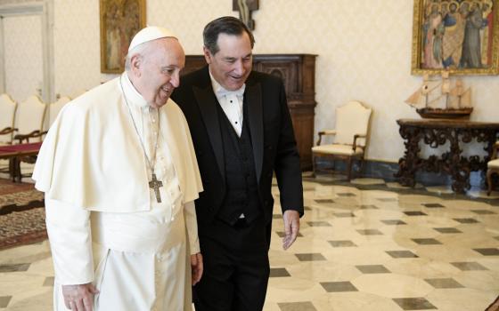 Pope Francis walks with Joe Donnelly, new U.S. ambassador to the Holy See, during a meeting for the ambassador to present his letters of credential, at the Vatican April 11, 2022. (CNS/Vatican Media)