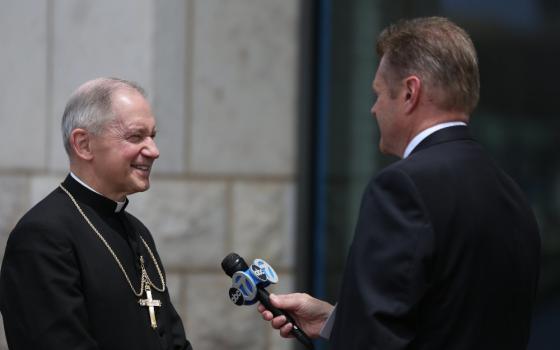 A reporter with ABC News interviews Bishop Thomas Paprocki of Springfield, Illinois, outside a Baltimore hotel during the spring general assembly of the U.S. Conference of Catholic Bishops June 12, 2019. (OSV News/CNS file/Bob Roller)