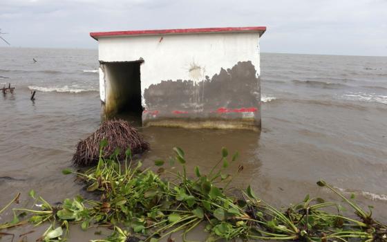 A house is flooded with sea water in El Bosque, Mexico, Nov. 7, 2022. Rising sea levels are destroying homes built on the shoreline and forcing villagers to relocate. (CNS photo/Reuters/Gustavo Graf)