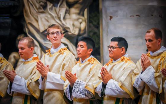 Deacon Zane Langenbrunner, second from left, at his Sept. 29, 2022, ordination as a transitional deacon in St. Peter's Basilica at the Vatican. Deacon Langenbrunner, an Indiana native, was selected to chant the Exsultet at the April 8, 2023, Easter Vigil with Pope Francis in St. Peter's Basilica. (OSV News photo/Jennifer Barton, Today's Catholic)
