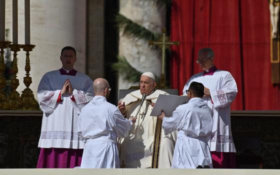 Pope Francis recites the opening prayer as he celebrates Easter morning Mass in St. Peter's Square at the Vatican April 9, 2023. (CNS photo/Chris Warde-Jones)
