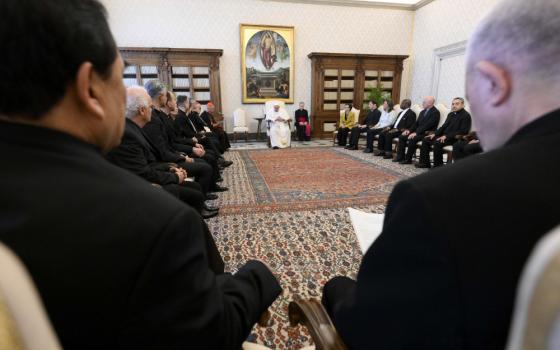 Pope Francis meets with members of the Pontifical Biblical Commission April 20, 2023, in the library of the Apostolic Palace at the Vatican. (CNS photo/Vatican Media)