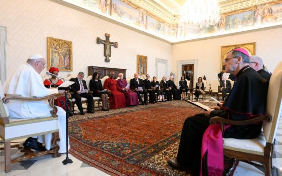 Pope Francis speaks to an interfaith delegation from England during an audience at the Vatican April 20, 2023. He told the group of religious and civic leaders from Manchester that the world needs new economic models that respect human dignity and protect creation. (CNS photo/Vatican Media)
