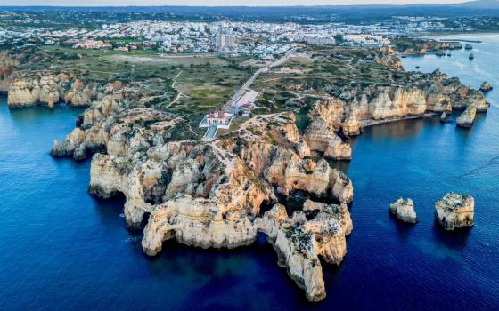 Water surrounds the coast of Cabo da Roca near Lisbon, Portugal, Friday, April 14, 2023. (AP Photo/Michael Probst)