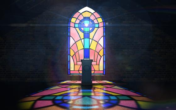 Pulpit in front of a stained glass window (Dreamstime/Albund)