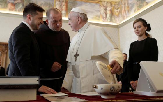Pope Francis exchanges gifts with Ukrainian President Volodymyr Zelensky during a private audience at the Vatican Feb. 8, 2020. (CNS photo/Gregorio Borgia, pool via Reuters) 