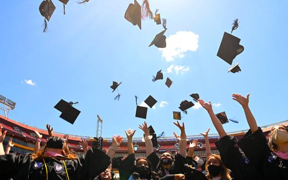 Graduates of the Catholic University of America celebrate during the school's 132nd annual commencement ceremony May 15, 2021, at FedEx Field in Landover, Maryland. (CNS/Courtesy of the Catholic University of America)