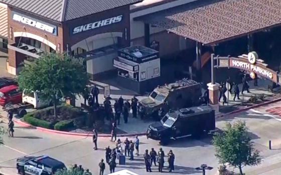Police respond to a shooting in the Dallas area's Allen Premium Outlets May 6, 2023, in a still image from video. Hours later law enforcement said the shooter, who was killed by police, had left at least eight people dead and injured at least seven others, some seriously. (OSV News photo/ABC affiliate WFAA via Reuters)