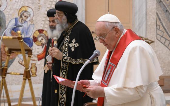 Pope Francis and Coptic Orthodox Pope Tawadros II of Alexandria, Egypt, lead prayers in the Redemptoris Mater Chapel of the Apostolic Palace at the Vatican May 11, 2023. Before the prayer service, Pope Francis announced he is adding to the Roman Martyrology, the list of saints' feast days, the 21 Coptic martyrs murdered by Islamic State terrorists in 2015. (CNS photo/Vatican Media)