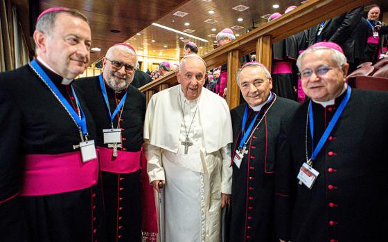 Pope Francis poses for a photo with bishops from the flooded areas of Emilia-Romagna, Italy, during the general assembly of the Italian bishops' conference at the Vatican May 22. From left are: Archbishop Lorenzo Ghizzoni of Ravenna-Cervia, Bishop Giovanni Mosciatti of Imola, Bishop Livio Corazza of Forlì-Bertinoro and Bishop Mario Toso of Faenza-Modigliana. (CNS/Vatican Media)