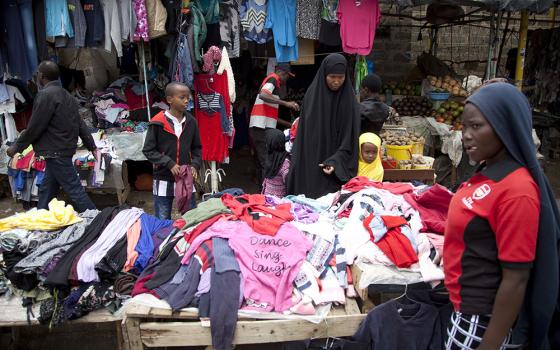 People look through piles of secondhand clothes at a roadside stall in Nairobi, Kenya,  April 8, 2018. (AP/Sayyid Abdul Azim)