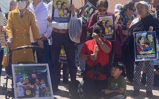 Members of Our Lady of Guadalupe parish gathered to pray for better asylum laws May 8 outside of a federal building in downtown San Diego that houses U.S. Immigration and Customs Enforcement. They joined Jesuit organizations and parishes nationwide in a novena May 7-12 asking for more compassionate laws toward migrants. (NCR photo/Rhina Guidos)