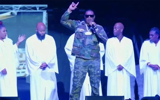 Percy "Master P" Miller dedicates the performance of the song "You Are Not Alone" to his late daughter Tytyana Miller on April 28 in New Orleans, during a benefit concert for the You Are Not Alone Foundation, a nonprofit he founded to honor her. (NCR screenshot/YouTube/No Limit Forever)