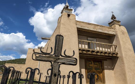 An exterior view of the San Jose de Gracia Catholic Church, built in 1760, April 14 in Las Trampas, New Mexico. Threatened by depopulation, dwindling congregations and fading traditions, some faithful are fighting to save their historic adobe churches and the uniquely New Mexican way of life they represent. (AP photo/Roberto E. Rosales)