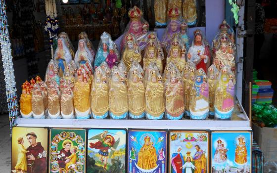 Statues of Our Lady of Velankanni dominate a display of religious items in Chennai, India. (Dreamstime/Yahodkumar05)