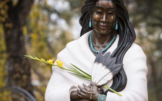 Detail view of the statue of St. Kateri Tekakwitha outside the Cathedral Basilica of St. Francis of Assisi in Santa Fe. This depiction of the Algonquin-Mohawk maiden by Jemez sculptor Estella Loretto has features and ornamentation representative of the Pueblo people. (CNS/Nancy Wiechec)