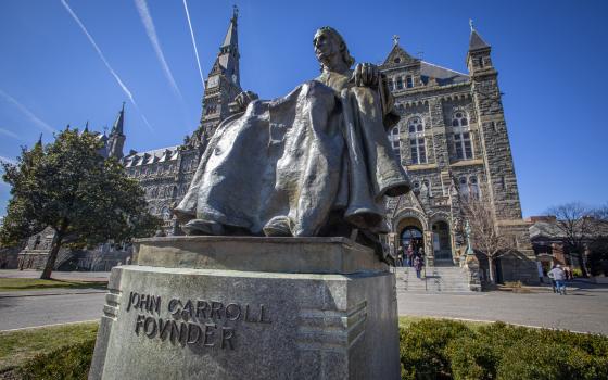 A statue of Baltimore Archbishop John Carroll, the first Catholic bishop in the United States and founder of Georgetown University, is seen on the Jesuit-run school's Washington campus March 3, 2022. Documents show Archbishop Carroll owned at least two slaves. (CNS/Chaz Muth)