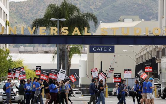 Workers and supporters of the Writers Guild of America protest outside Universal Studios Hollywood May 3, in the Universal City area of Los Angeles a day after union negotiators called a strike for film and television writers. (OSV News/Reuters/Mario Anzuoni)