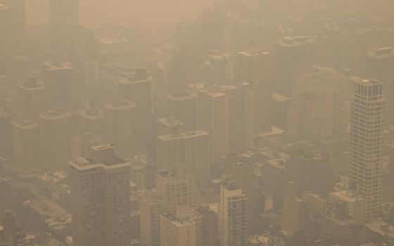 In a view from the Empire State Building observatory June 7, New York City is engulfed in a haze of thick, smoky air from Canadian wildfires. (AP/Yuki Iwamura, File)