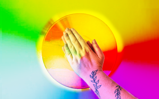 Praying hands in rainbow colors (Maxwell Kuzma)