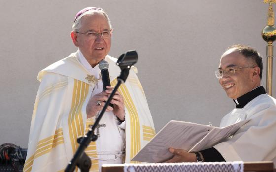 Los Angeles Archbishop José H. Gomez and Father Brian Nunes, then the archbishop's priest secretary, are pictured at the dedication of a new gymnasium at Sacred Heart High School in Northeast LA in 2019. Pope Francis named Father Nunes as an auxiliary bishop for the Archdiocese of Los Angeles July 18, 2023. (OSV News photo/Victor Alemán, Angelus News)