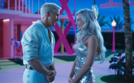 Ryan Gosling and Margot Robbie star in a scene from the movie “Barbie.” (OSV News/Warner Bros.)
