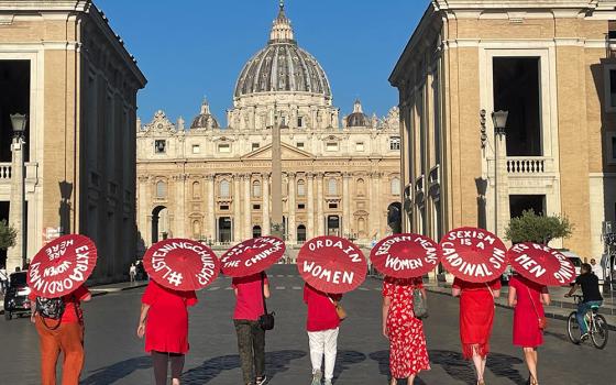 Women's ordination advocates walk toward St. Peter's Square as part of a witness on Aug. 29, 2022. (NCR photo/Christopher White)