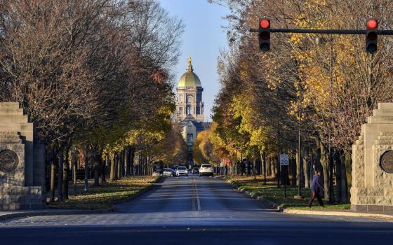 The dome is seen from the entrance to the campus of the University of Notre Dame, Saturday, Nov. 7, 2020, in South Bend, Ind. A University of Notre Dame professor has filed a defamation lawsuit against a student-run online publication over coverage of her abortion rights work. The case is raising questions about press freedom and academic freedom at one of the nation’s preeminent Catholic institutions of higher education. (Matt Cashore/Pool Photo via AP)