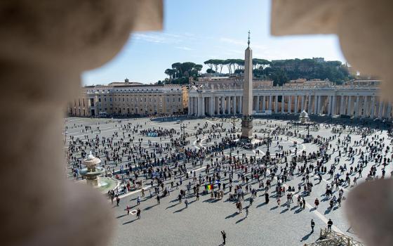 People in St. Peter's Square attend Pope Francis' recitation of the Angelus at the Vatican Nov. 8, 2020. The pope said people sometimes forget that life's ultimate purpose is preparing for the kingdom of heaven. (CNS/Vatican Media)