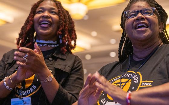 Nina Shipman-Vick and Valerie Grays from the Archdiocese of Baltimore participate in the opening plenary session of the 13th National Black Catholic Congress July 21 at the Gaylord National Resort & Convention Center in National Harbor, Maryland. (OSV News/Catholic Standard/Mihoko Owada)