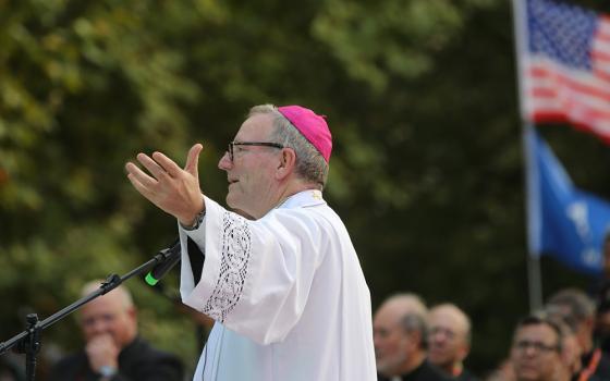 Bishop Robert Barron of Winona-Rochester, founder of Word on Fire Catholic Ministries, speaks at a National Gathering for U.S. pilgrims, at Quintas das Conchas e dos Lilases Park Aug. 2 in Lisbon, Portugal, during World Youth Day. (OSV News/Bob Roller)