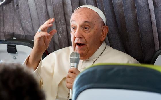 Pope Francis answers questions from journalists aboard his flight back to Rome from Lisbon, Portugal, Aug. 6, 2023, after his participation in World Youth Day. 