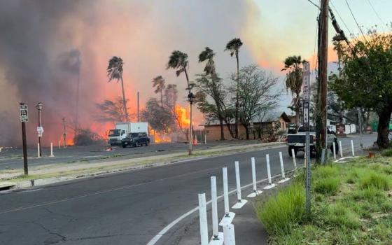 Smoke and flames rise in Lahaina, Hawaii, on the island of Maui Aug. 8, 2023 in this still image from video obtained from social media. (OSV News/Reuters/TMX/Jeff Melichar)