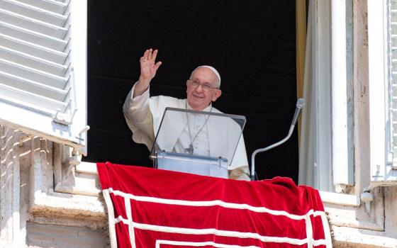 Pope Francis greets visitors in St. Peter's Square at the Vatican to pray the Angelus Aug. 20, 2023.